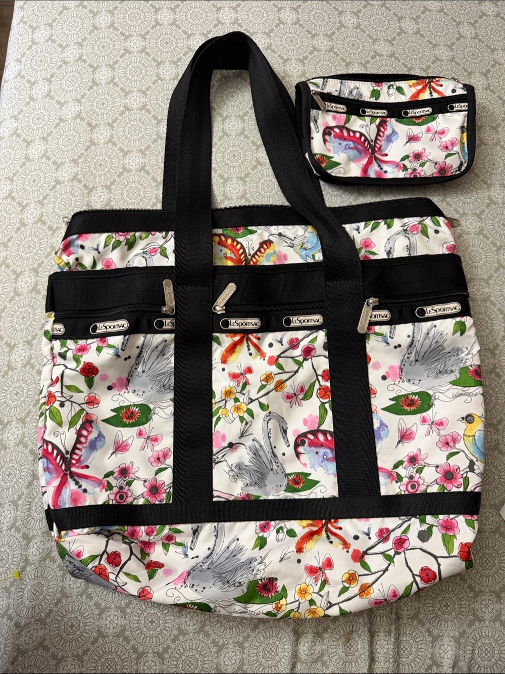 Lesportsac White Floral,Butterfly, & Swan tote & makeup bundle